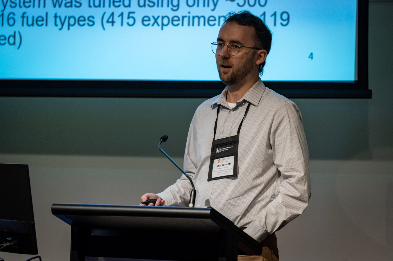 Image of Liam presenting at a wildfire conference